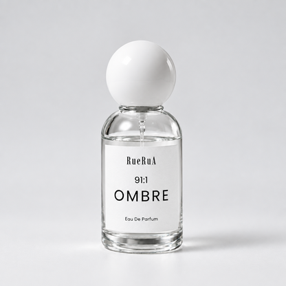 A clear glass bottle of BueRuA 5:24 LIFE Eau De Parfum with a matte white spherical cap, set against a clean light gray background.