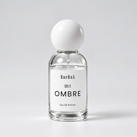A clear glass bottle of BueRuA 5:24 LIFE Eau De Parfum with a matte white spherical cap, set against a clean light gray background.